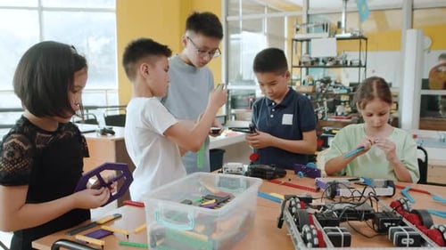 Children Building Robots in a Classroom STEM Project