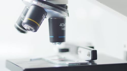 Lab Microscope Lens Changes Focus for Medical Analysis