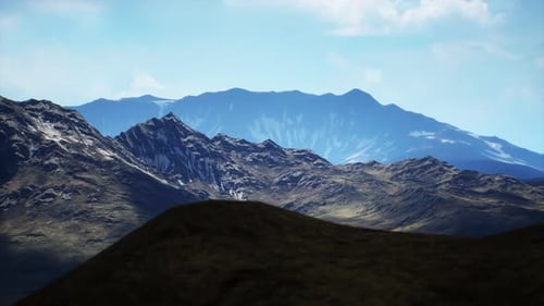 Majestic Mountain Landscape with Rugged Terrain and Clear Skies in Daylight