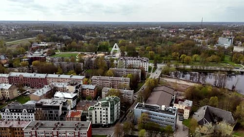 Aerial drone fly above Riga Latvia autumnal landscape city buildings green Park