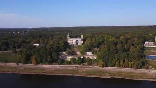 grand majestic castle by tranquil river. Dramatic aerial top view flight overflight flyover drone
4k