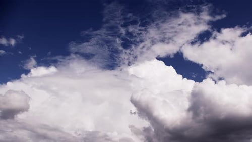 White Clouds Moving in Blue Sky Time-Lapse