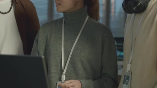 IT Coordinator Talking with Network Engineers in Office