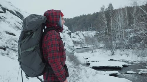 Tourist Enjoying the View on Winter Nature from Mountain Peak