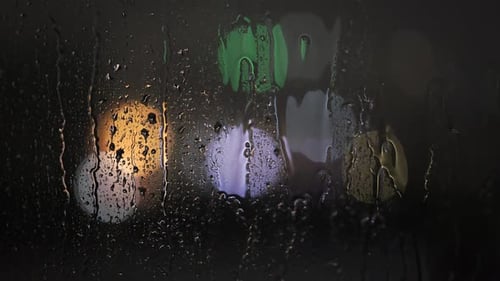 Rainy Weather and Lightning Outside View Through the Window at Night