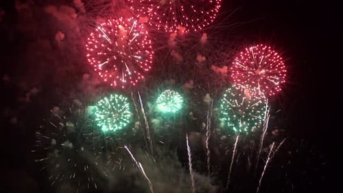 The beauty of the fireworks on the night sky. Colorful fireworks light up the sky. The view of the f