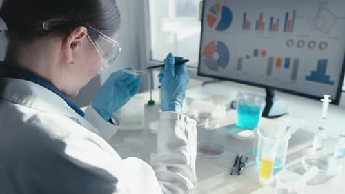 Woman Scientist Conducting Medical Research in Laboratory