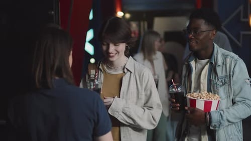 Showing Tickets And Entering Cinema Hall