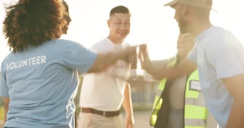 Volunteer, team building and charity, hands together for applause and huddle
