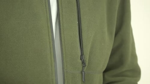 Close Up of Olive Green Fleece Jacket Unzipping