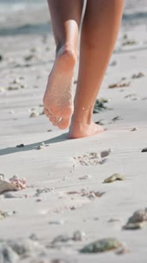 Person Walk Along Sandy Beach Close Up Back View