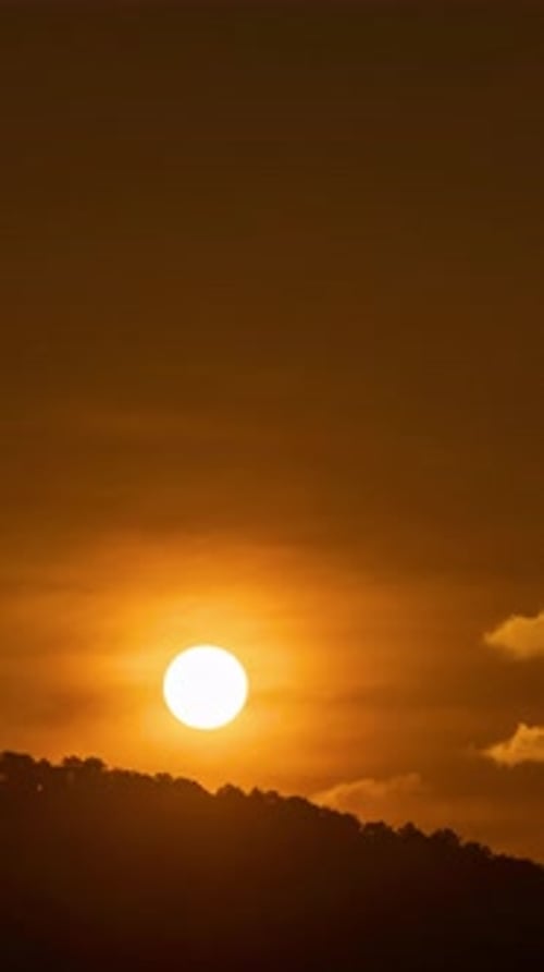 Brilliant Golden Sun Rising Above Dark Horizon