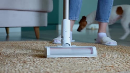 Close Up of Vacuum Cleaner Brush Cleaning Carpet on Floor