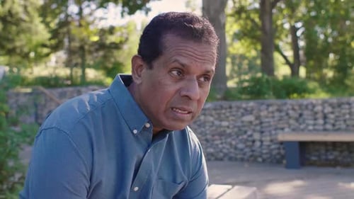 Mature Couple Talking in Park 4549 Years