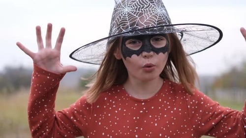 Girl Witch Costume Outdoors, Smiling