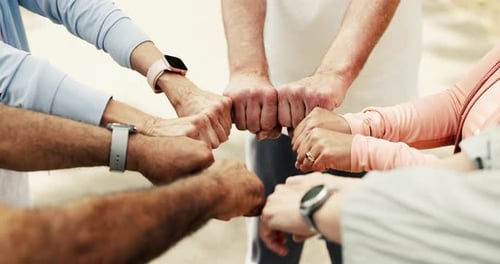 Fitness, above and people in circle with fist bump, unity or encouragement in training support