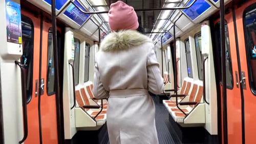 Young Black Woman Riding Subway Train