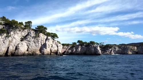 Beautiful rocky cliffs by the sea, filmed from boat