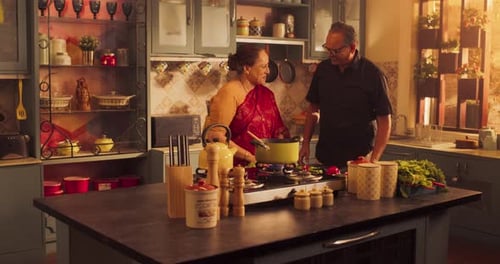 Adult Couple Cooking Together in Warm Kitchen