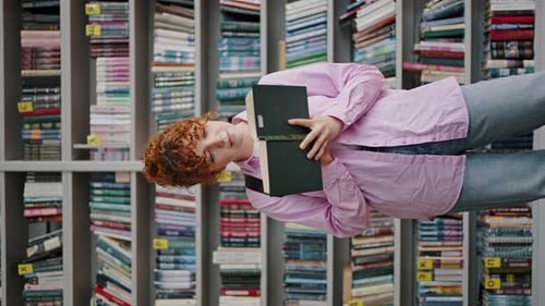 Young Woman Reads Book in Vertical Portrait Format