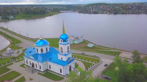 Aerial View of the City Located in Picturesque Area on a Summer Day