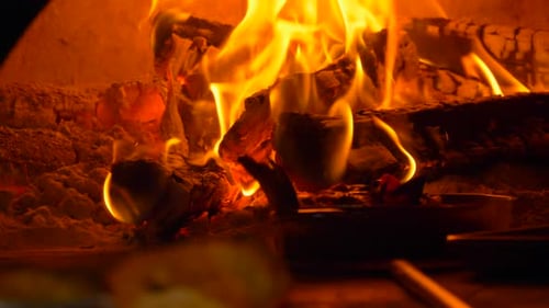 Roaring Fire with Flames and Burning Wood Logs