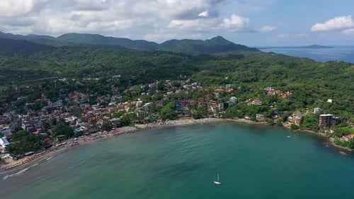 Scenic Tropical Coastline with Beach Town Aerial View