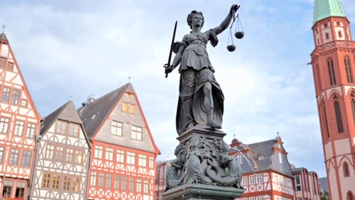 Justice fountain square statue and buildings in Frankfurt, Germany