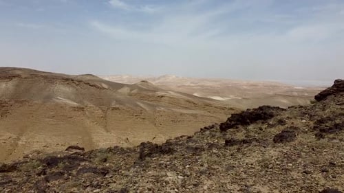 aerial, forward, fast drone shot moving from the ground on a top of a hill, revealing a beautiful vi