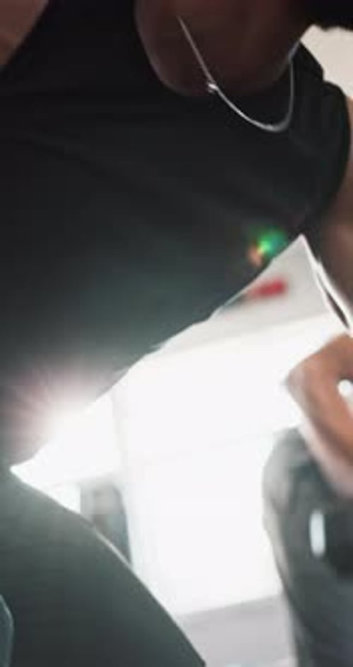 Hand, dumbbells and man in gym, training and cardio with exercise, wellness and challenge