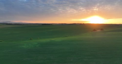 Beautiful View of Setting Sun Over Field Landscape
