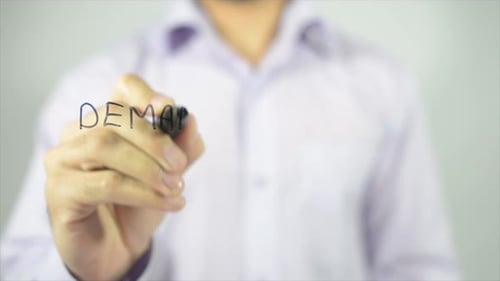 Demand and Supply Written on Clear Surface