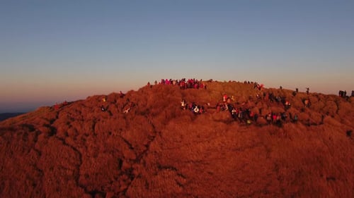 Aerial video of Mount Pulag at sunset with people in the background, the third highest mountain