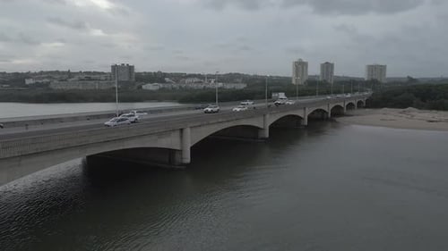 Aerial View of Bridge with City Skyline