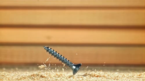 Selftapping Screws Fall on a Wooden Surface Filmed on a Highspeed Camera at 1000 Fps