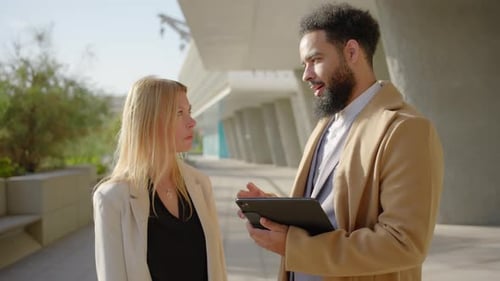 A Business Meeting Taking Place Between Two Professionals in a Contemporary Modern Setting