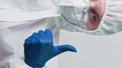 Medical Worker in PPE Gives Thumbs Up