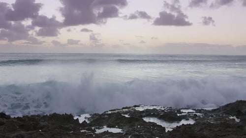 Wave Crashing in Slow Motion on Rocks with Cinematic Splashes Clear Ocean Water
