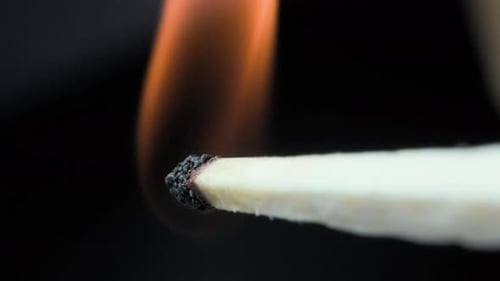 lighting match stick closeup view