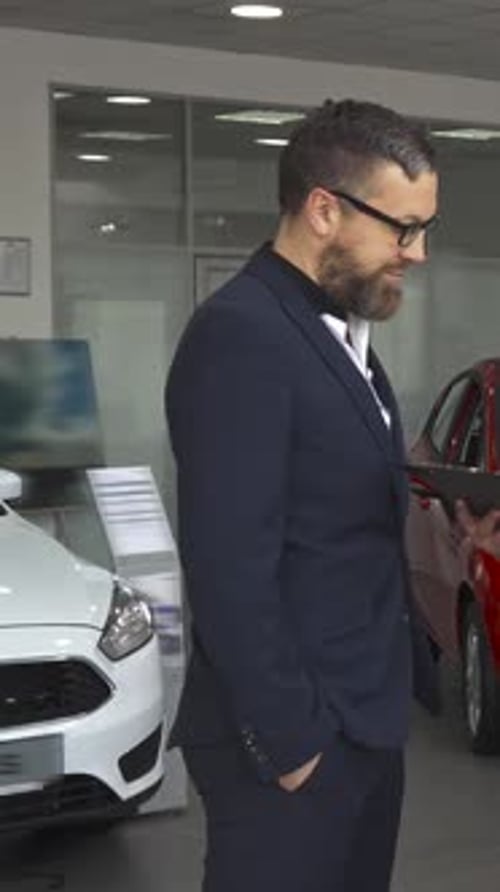 Sales Manager Passionately Explains Contract Details to a Customer at the Car Dealership