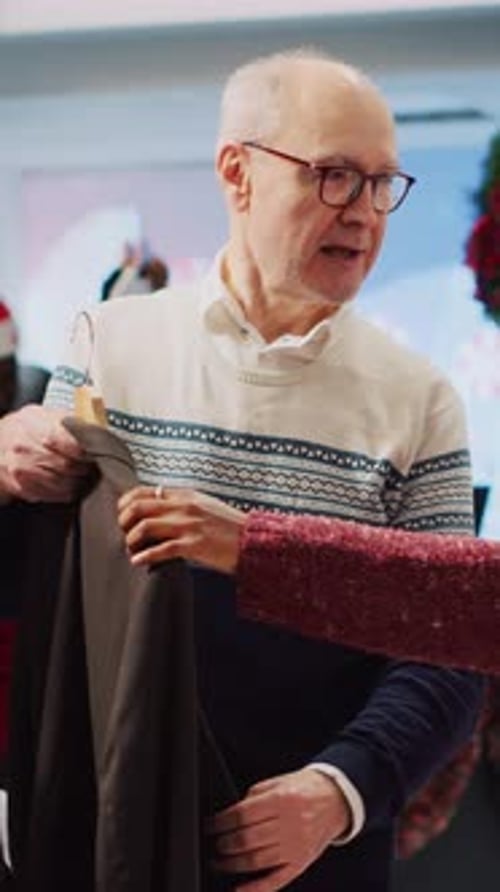 Senior Man Shopping for Clothes at Christmas Store