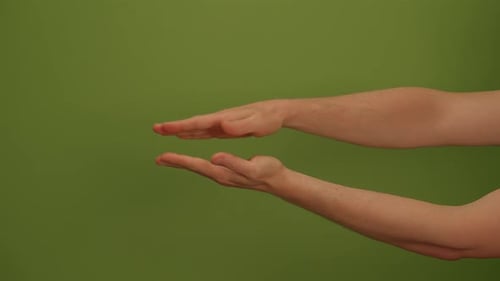 The Gesture of Outstretched Hands is Beautifully Showcased Against a Vibrant Green Background