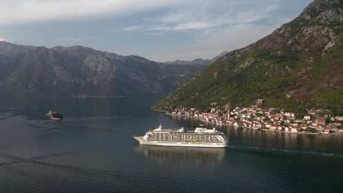 Large cruise ship passing through the picturesque bay of Kotor in Montenegro