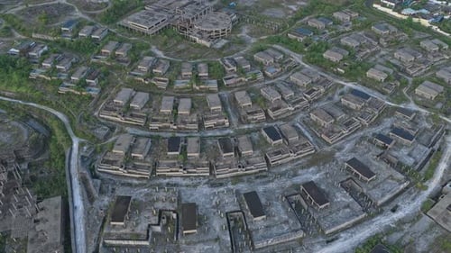 Aerial view flying over an abandoned unfinished town