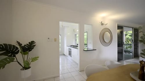 Contemporary home, kitchen, dining room into living room. Family area. White finishes in a white hou