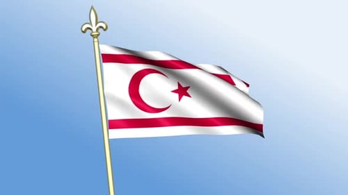 Waving Flag of Northern Cyprus Against Blue Sky