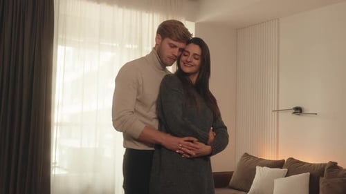 Loving Couple Embracing in a Cozy Home