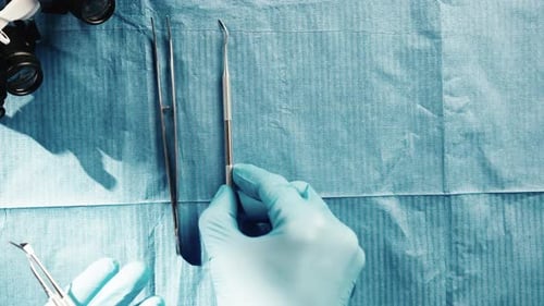 Instrumentalist Medical Dentist is Arranging Instruments on the Work Table