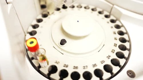 Medical Machine Analyzing Test Tubes in Lab