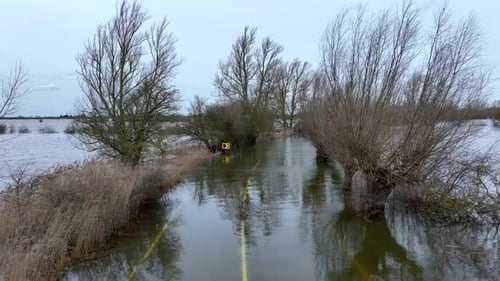 Low Aerial View of a Flooded Section of Road Uk